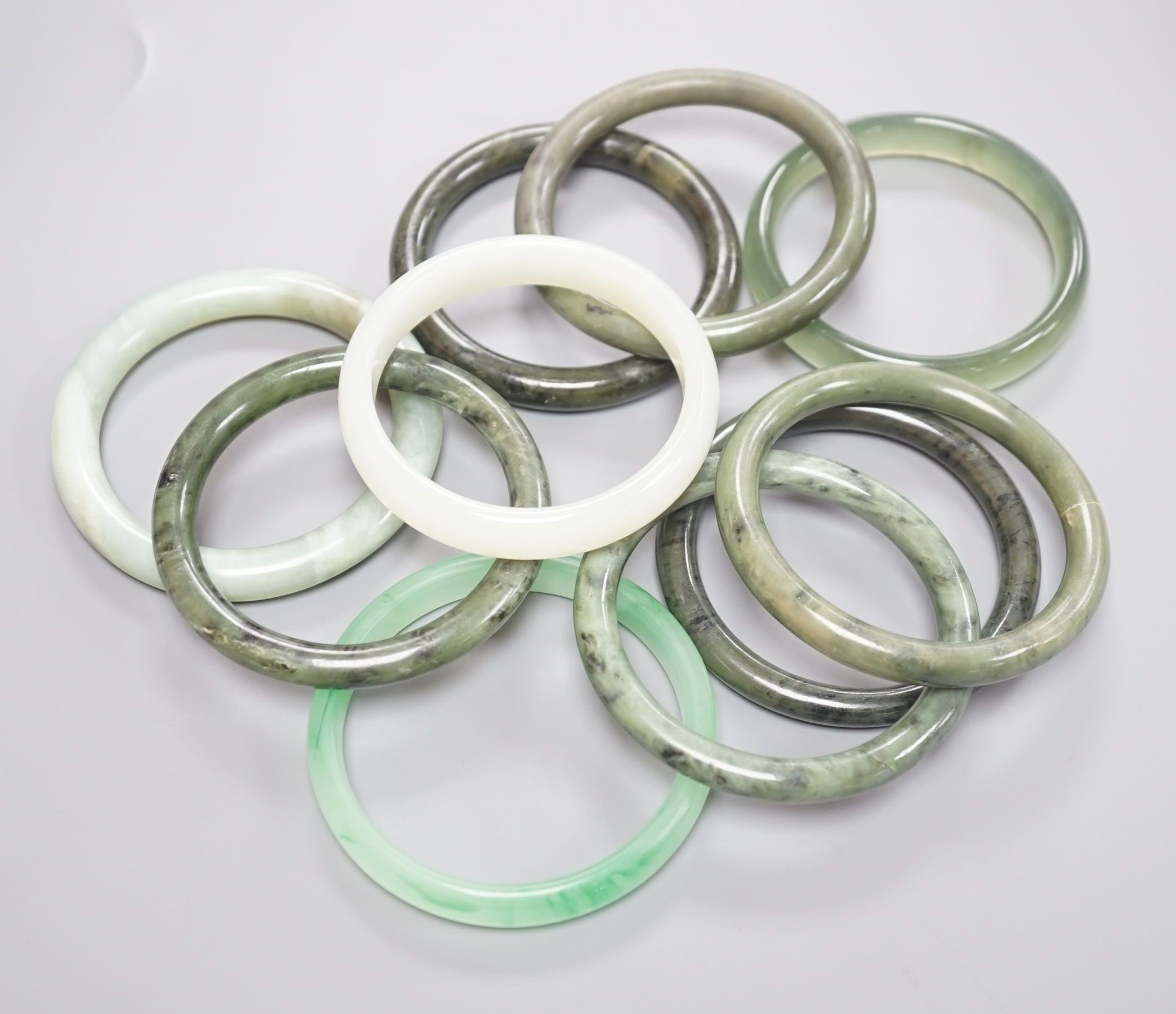 Ten assorted Chinese? Jade or hardstone bangles.